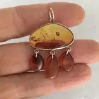 تعليقة من الفضة الخالصة بحجر العنبر الكهرمان بسعر 150 ريال