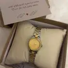 ساعة وفساتين