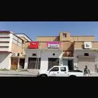 للبيع مبنى تجاري محلات وغرف عزاب