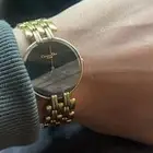 ساعة كرستيان ديور مطلية ذهب