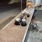 متخصص كرك شاي على الجمر ذرة مشوي