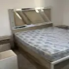 غرفت نوم مع دولابها والفرشه ومرتبه سرير.(  الموقع رنيه )