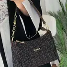 شنط ماركة دكني صممت للمرأة لا تقبل إلا بالكمال شنطات DKNY