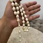 مسباحين عاج ناب الفيل مخزنه