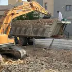حفر وترحيل . بوكلين