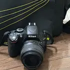 كاميرا نيكون D5100 الرقمية SLR بدقة 16.2 ميجابكسل وعدسة VR