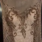 فستان سهرة نسائي باللون الذهبي