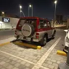 جيب نيسان باترول باب واحد موديل 92 احمر وذهبي