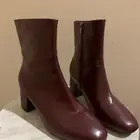 بوت قصير كعب عالي للنساء مزين بالجلد وتصميم فرنسي أنيق