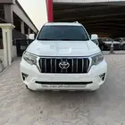 تويوتا برادو نص فل TXL V6 ابيض ممشى 112 الف بنزين 2020