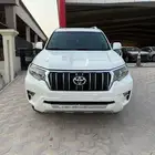 تويوتا برادو نص فل TXL V6 ابيض ممشى 112 الف بنزين 2020