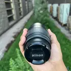 عدسة نيكون أصلية 55-200mm بحالة ممتازة  تعمل بكفاءة تامة