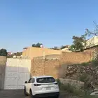 ارض مبني عليها بيت شعبي بحي عودة للبيع