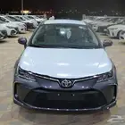 تويوتا كورولا ماكينة 2.0 مطور ابيض ورمادى وفضى
