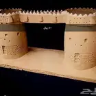 مجسمات صغير لمعالم تراثيه نجدية