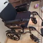 كرسي متحرك كهربائي ( عربة كهربائية )