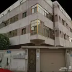 عمارة للبيع في شارع الامومة  حي النزهة