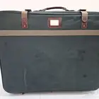Green suitcase شنطة سفر أخضر