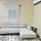 كنب رمادي حرف L