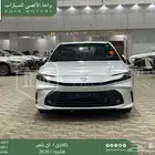 تويوتا كامري E بلس ابيض هايبرد 2025 اقل سعر كاش واقساط