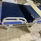 سرير طبي وكرسي كهربائي