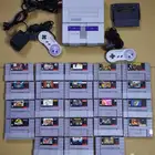 تم البيع- جهاز سوبر نينتندو مع يدين و 23 شريط اصلي snes