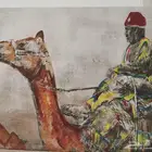 لوحة موقعه رسم يدوي أعرابي يمتطي بعيرا