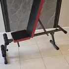 بنش رياضي و شنطة أوزان 30 كغ و بار متعرج مع أوزان ربل