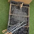 منقل نار حديد مع الفحم والحطب واغراض الشوي