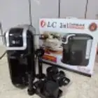 آلة قهوة وآلة فطائر وساعة ورف ديكور وطقم رجالي ومغسلة وكنبطف