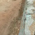 سائق بكلين لبناء الحجر وقص الاراضي