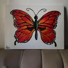 لوحه جدار كانفوس مرسومه يدويا فراشه برتقاليه