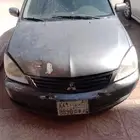 متسوبيشي لانسر 2010لون رمادي الرخصه توها منتهيه لها اسبوع ا