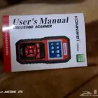 جهاز كمبيوتر لفحص أعطال السيارات وإصلاحها